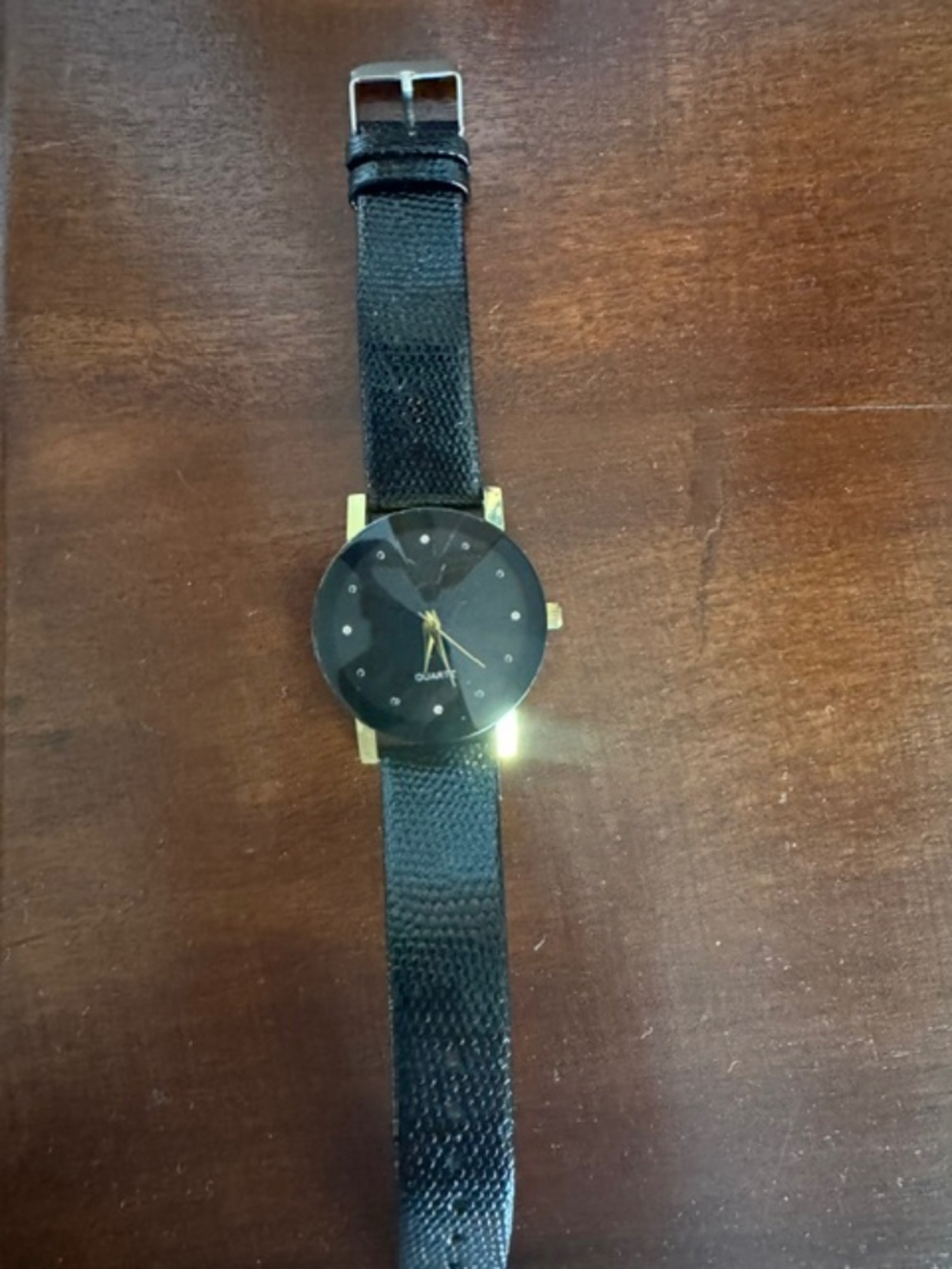 Gold- tone Quartz/black faceted crystal face and textured black leather band